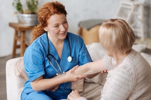 Icon of a nurse helping a patient.